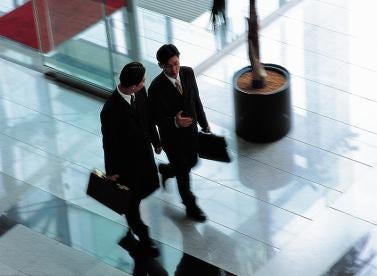Businessmen walking, company sales, employee incentives