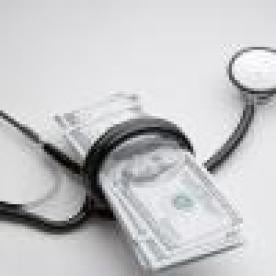 doctor stethoscope around healthcare money managed by CMS medicaid services