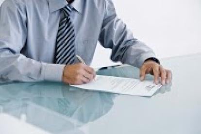 businessman with paperwork, contract drafting