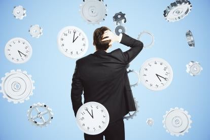 business person confused by overtime and hourly wage clocks