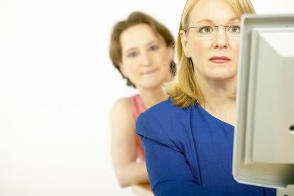 Woman Looking over shoulder Preventing Corporate Espionage 