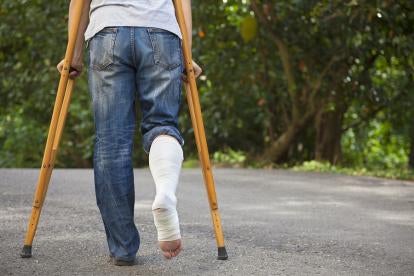 man on crutches, workers compensation, credits due