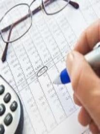 tax bill, glasses, calculator