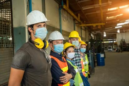 masked workers in and OSHA approved working environment