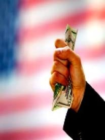 hand holding money with american flag background