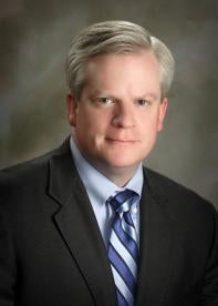 Bruce H. Raymond, litigation attorney with Raymond Law Group