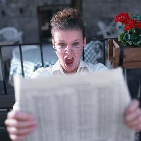 lady reading paper screaming 