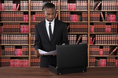 attorney inspecting corporate litigation documentation