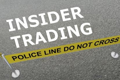 a mock crime with text Insider Trading with yellow police caution tape with a do not cross warning