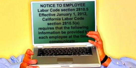 Man Holding PC with Notice to employee California Labor Code