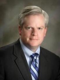 Bruce H. Raymond, litigation attorney with Raymond Law Group