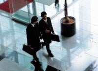 Business men walking - relationships in legal marketing