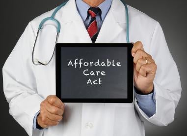 doctor holding ACA tablet, section 1557