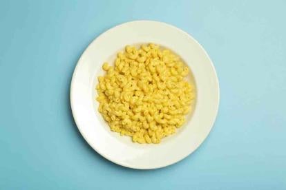 Macaroni and Cheese bowl on a blue background