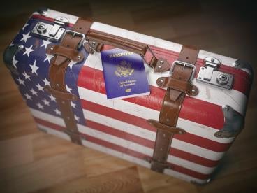 immigration suitcase with US Passport