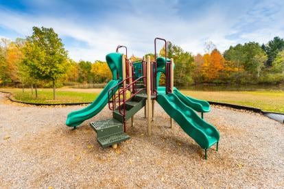 playground in a park with outdoor play equipment
