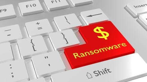 ransomware button on keyboard that costs healthcare industry milions