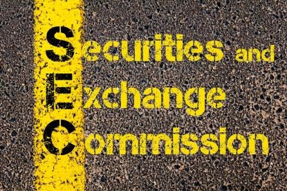 Securities Exchange Commission SEC in yellow paint on a road