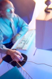 blurry man at the computer, phishing scams, ftc