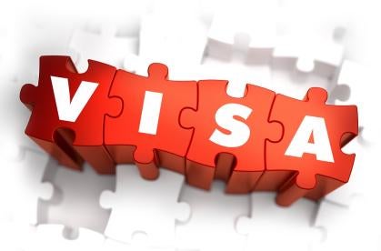 VISA spelled out on red puzzle pieces