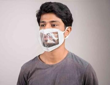Man in Clear Mask complying with COVID State Response