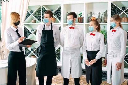 Restaurant Workers working with Masks and Complying with state guidelines