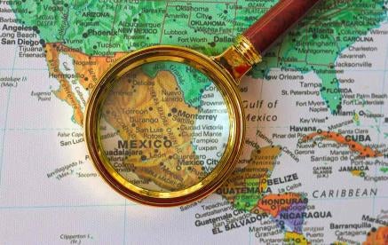 Mexico on a map with an eye glass