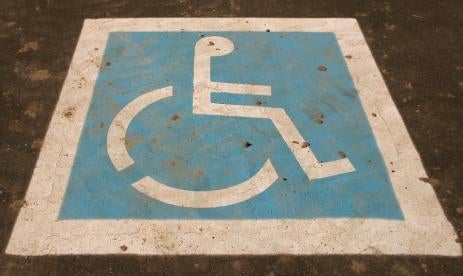 americans with disabilities logo in a theater parking lot