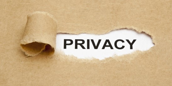 Privacy law concept revealed under torn brown paper