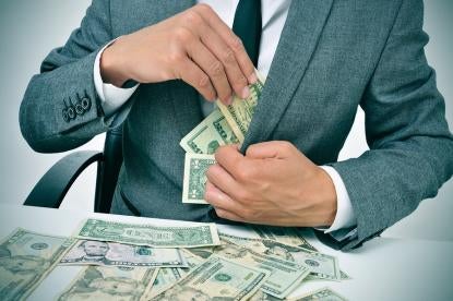businessman stuffing money in suit, yates memo, fcpa