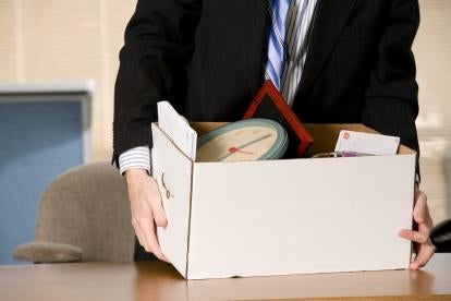 terminated employee with his box of workplace items