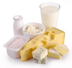 array of cheeses and dairy products: milk, yogurt, brie, feta