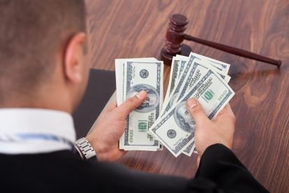 courtroom judge with settlement money