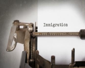 Immigration on typewriter 