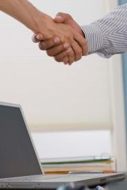 Shaking hands finalizing M&A covenants contracts