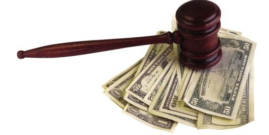 gavel and a stack of money depicting a tcpa settlement