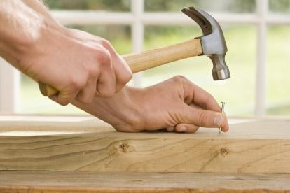 hammering a nail, construction contracts, coverage gaps