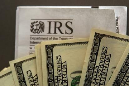 Internal Revenue Service IRS tax forms with money