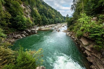 river in the mountains with water of the united states flowing in it