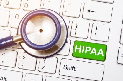 HIPAA on the keyboard in the doctor's office with stethoscope