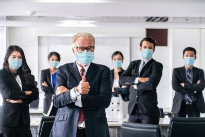 people in office with masks 