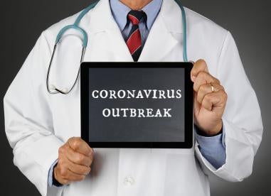 coronavirus outbreak words on ipad doctor 