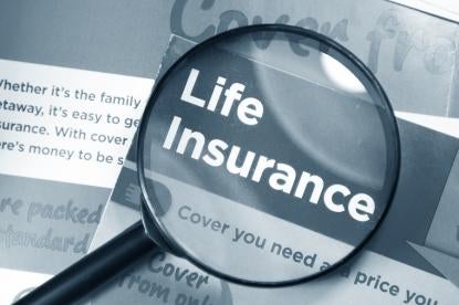 life insurance policy documents under magnifying glass