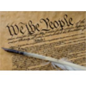 We the People text of the Constitution, old scroll, feather quill