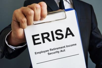 an employee holding up an ERISA Employee Retirement Income Security Act document on a clipboard