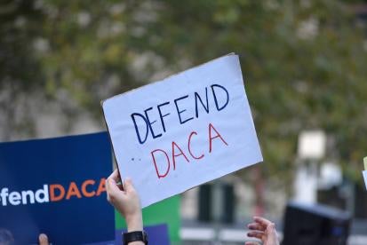 Defend DACA sign held up by protester