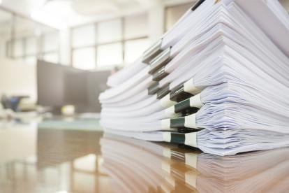 stack of paperwork depicting margin rules for agency transactions