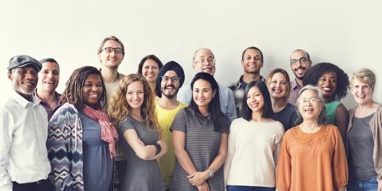 group of gender, race, nationality diverse happy employees dressed casually
