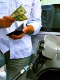 Man Putting Gas in Car with Money