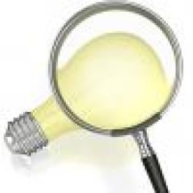 Magnifying glass on lightbulb